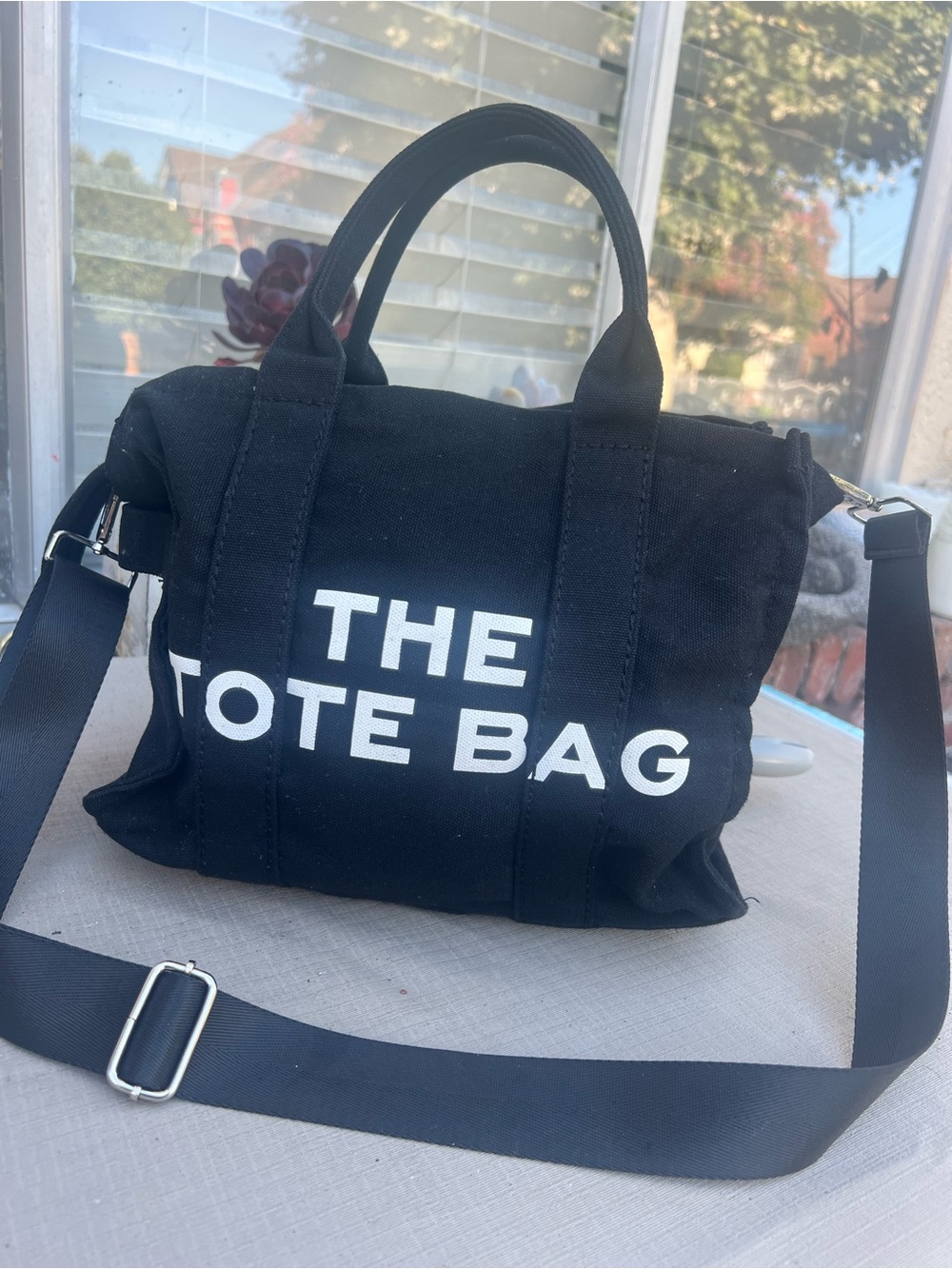 Black Canvas Messenger Bag with 'THE TOTE BAG' Print